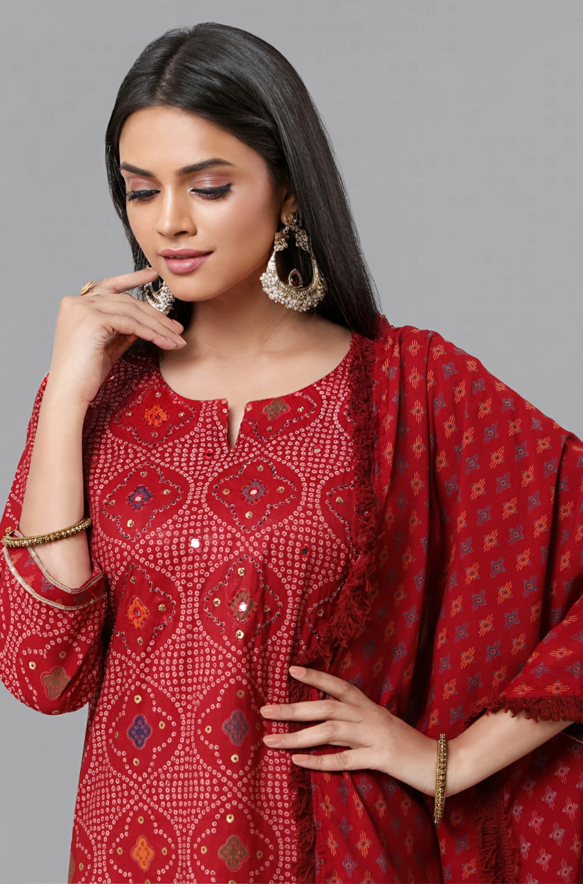 Suja Roy's Labrenda - This breezy and bright red Kurti embellished with a  glistening choice of Zardosi and Kundan work is for all those who fancy  being effortlessly gracious. Available at all